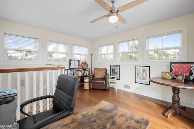 office space with hardwood / wood-style flooring and ceiling fan