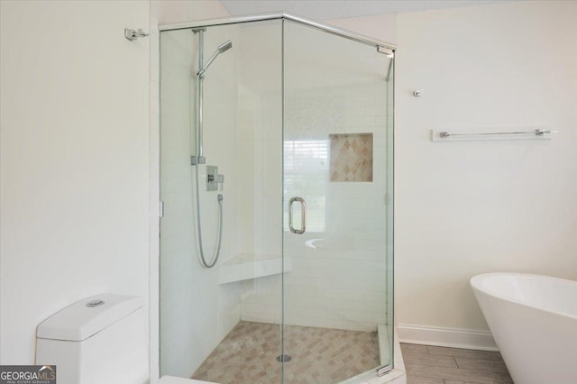 bathroom with shower with separate bathtub and toilet