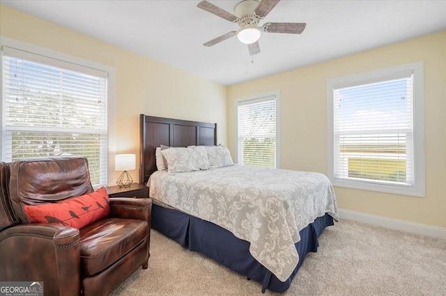 carpeted bedroom featuring ceiling fan