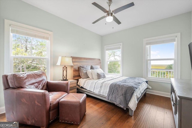 bedroom featuring ceiling fan and dark hardwood / wood-style flooring