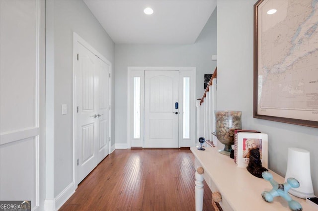 foyer with wood-type flooring