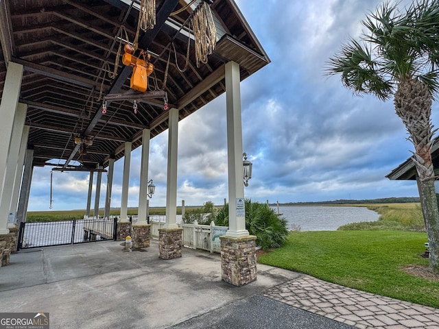 view of patio with a water view