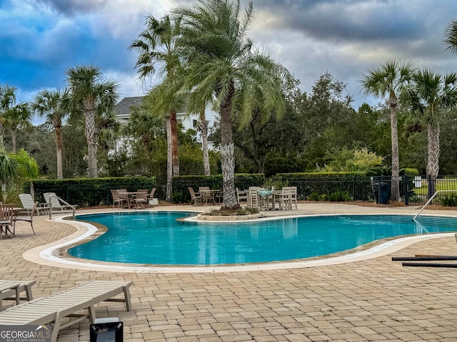 view of swimming pool with a patio area