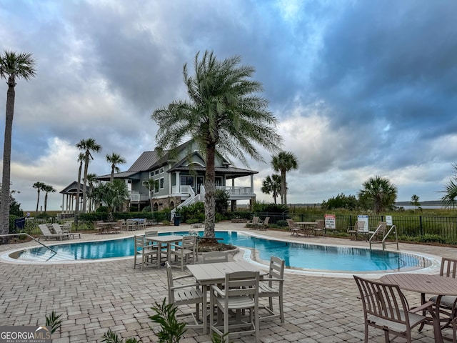 view of swimming pool featuring a patio