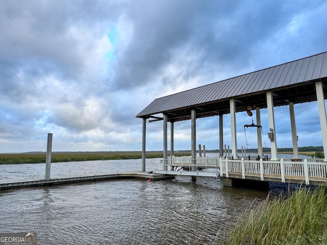 dock area with a water view