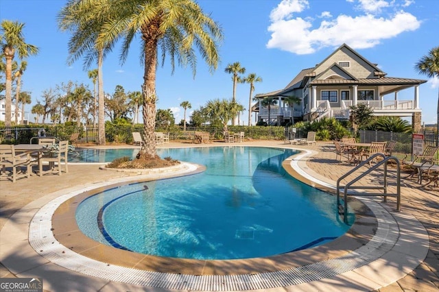 view of swimming pool with a patio