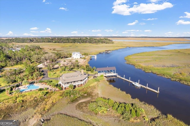 birds eye view of property featuring a water view and a rural view