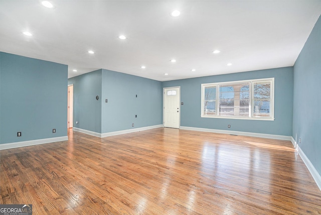 unfurnished living room featuring light wood-type flooring