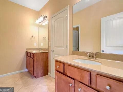 bathroom featuring tile patterned floors and vanity