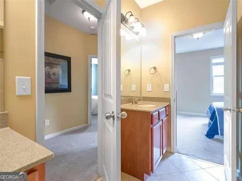 bathroom with vanity and tile patterned floors