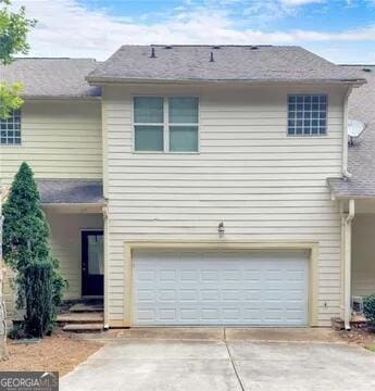 front of property with a garage