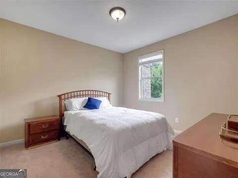 bedroom with light colored carpet