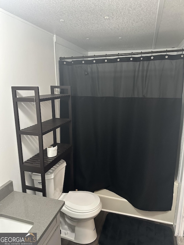 bathroom with vanity, a shower with shower curtain, a textured ceiling, and toilet