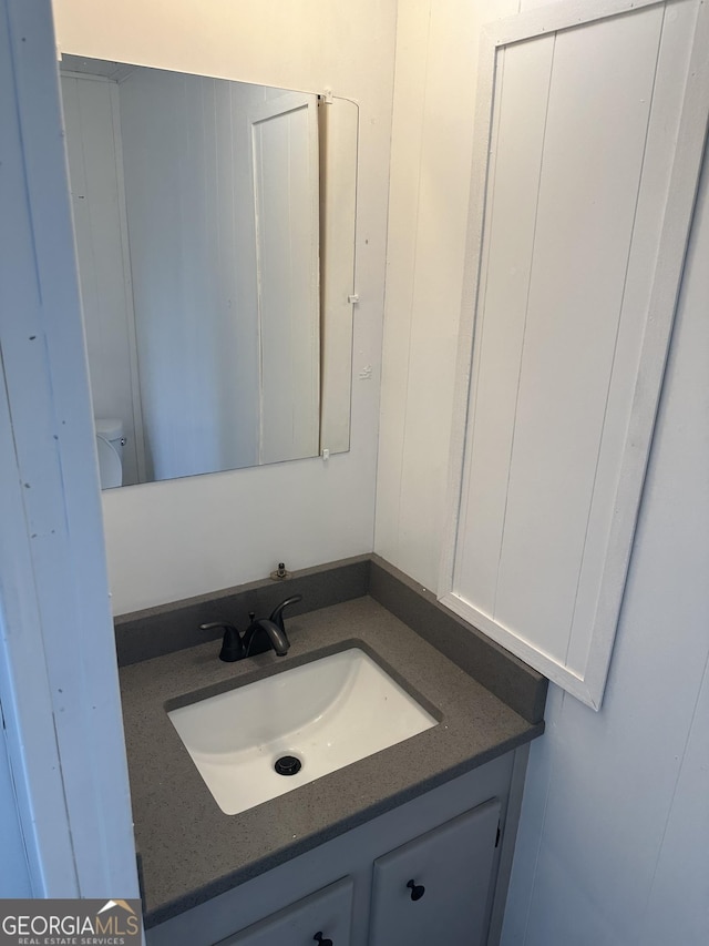 bathroom with vanity and toilet