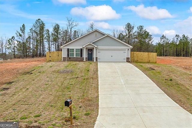 view of front of home with a front yard and a garage