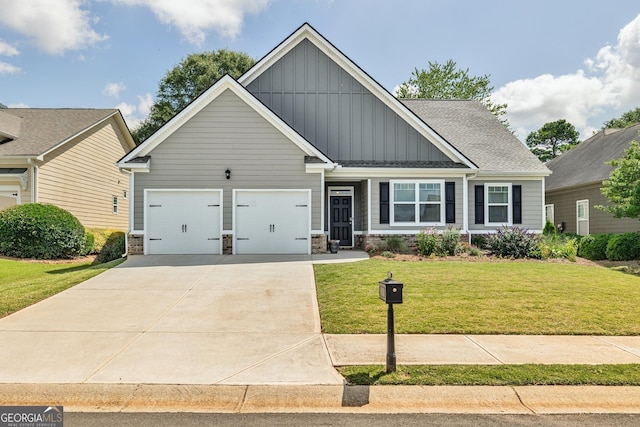 craftsman-style home featuring a front yard and a garage