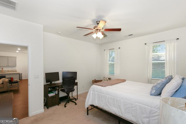 carpeted bedroom featuring ceiling fan