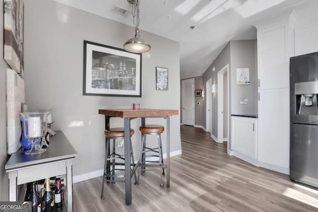 dining space featuring light hardwood / wood-style flooring