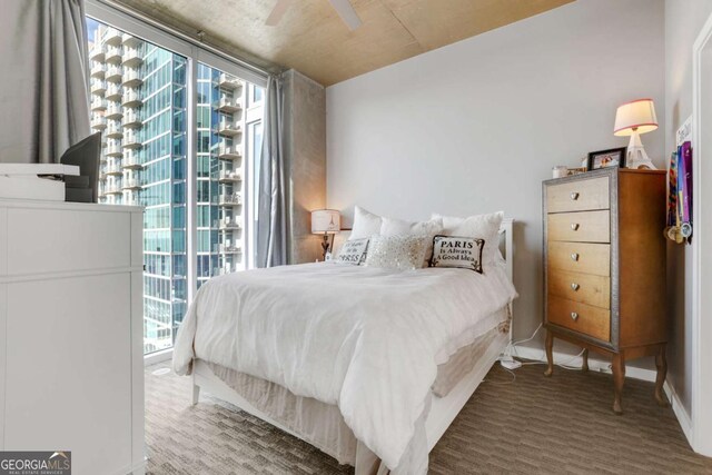 bedroom featuring multiple windows and ceiling fan