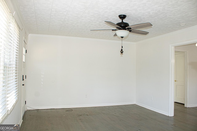 empty room with dark hardwood / wood-style floors, ceiling fan, and ornamental molding