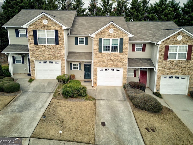 townhome / multi-family property featuring a garage