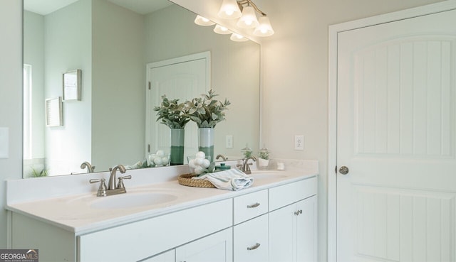 bathroom featuring plenty of natural light and vanity