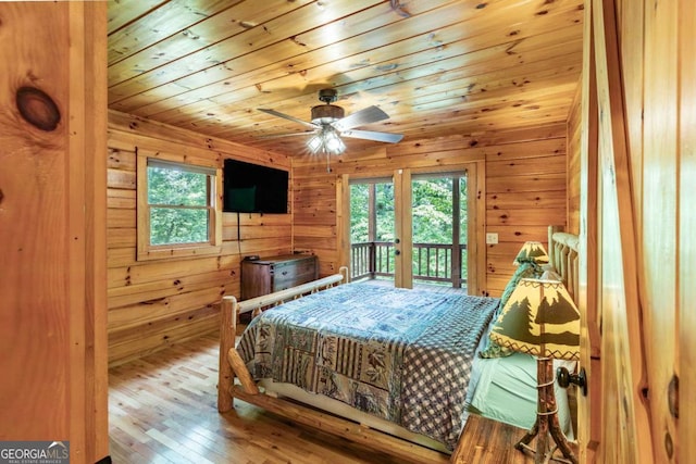 bedroom with multiple windows, access to exterior, ceiling fan, and wooden ceiling