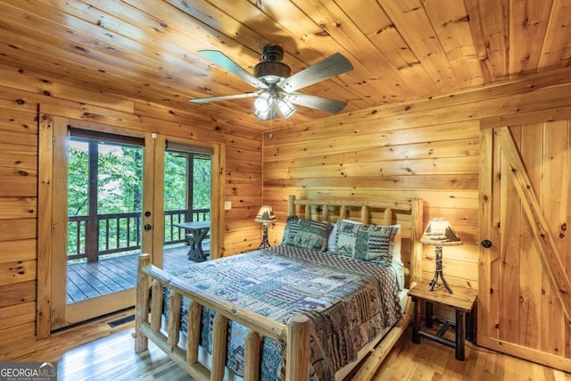 bedroom featuring access to outside, french doors, light hardwood / wood-style flooring, ceiling fan, and wood ceiling