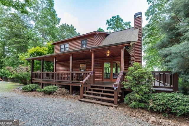 log home featuring a porch