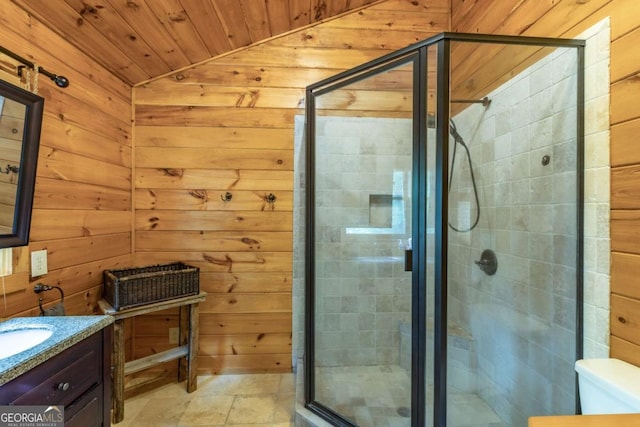 bathroom featuring an enclosed shower, vanity, vaulted ceiling, wooden walls, and wooden ceiling