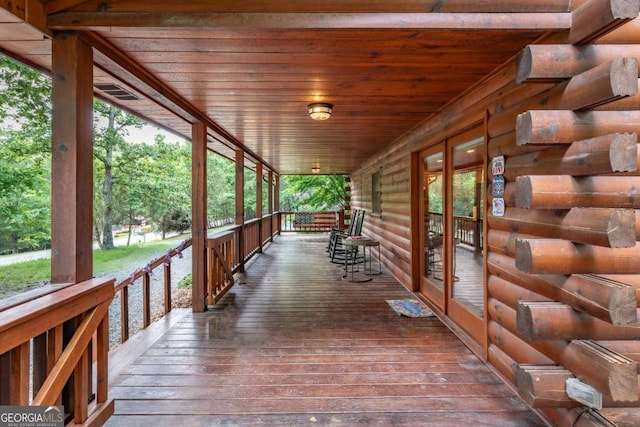 wooden deck featuring a porch