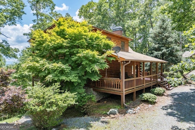 view of side of home featuring a deck