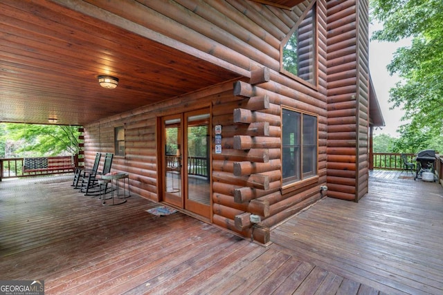 wooden terrace featuring a porch