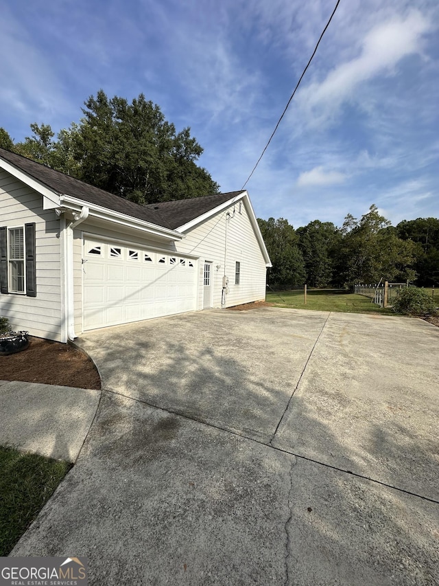 view of side of property featuring a garage