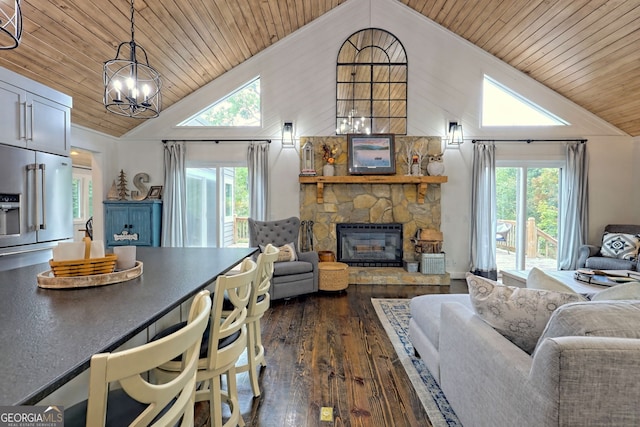 living room with dark hardwood / wood-style flooring, a fireplace, high vaulted ceiling, and wooden ceiling