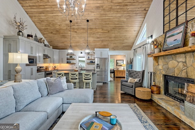 living room featuring a stone fireplace, sink, high vaulted ceiling, and dark wood-type flooring