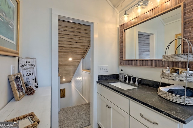 bathroom with ornamental molding, vanity, lofted ceiling, and wooden ceiling