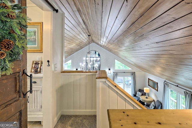 bonus room featuring carpet flooring, a notable chandelier, wooden ceiling, and lofted ceiling