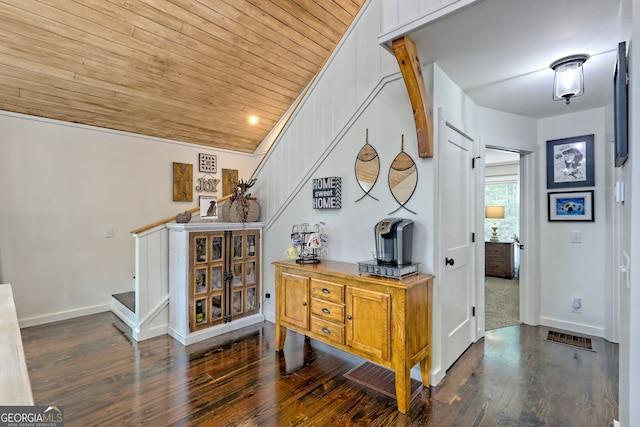 hall featuring dark hardwood / wood-style floors and wood ceiling