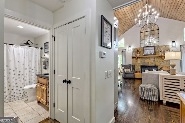 interior space with hardwood / wood-style floors, wooden ceiling, and a chandelier