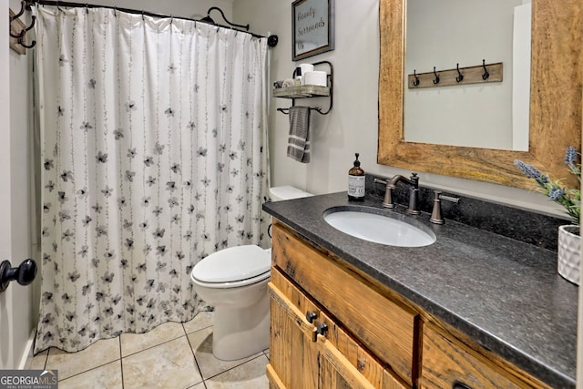 bathroom featuring tile patterned flooring, vanity, toilet, and a shower with shower curtain