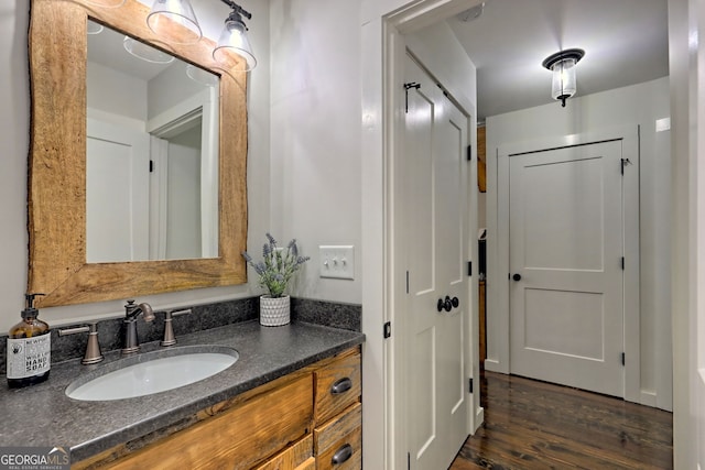 bathroom featuring hardwood / wood-style floors and vanity