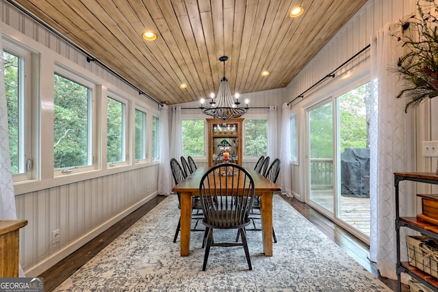 sunroom with plenty of natural light, wood ceiling, and a chandelier