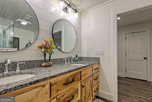 bathroom with vanity, ornamental molding, and hardwood / wood-style flooring