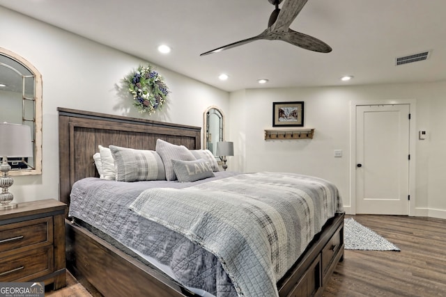 bedroom with hardwood / wood-style flooring and ceiling fan