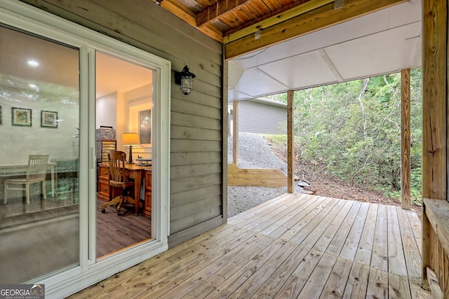 unfurnished sunroom with wood ceiling