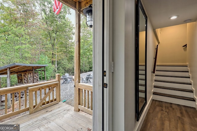 doorway with wood-type flooring