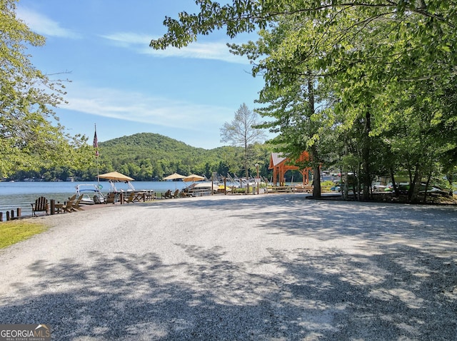 view of street with a water and mountain view