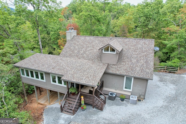 view of front of house featuring central air condition unit and a wooden deck