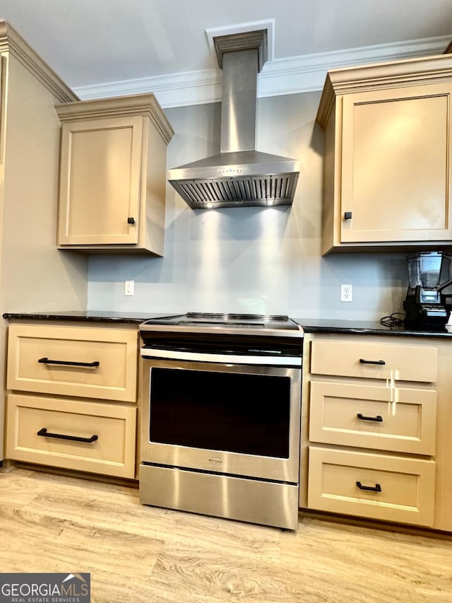 kitchen with light hardwood / wood-style flooring, crown molding, wall chimney exhaust hood, and stainless steel range with electric cooktop